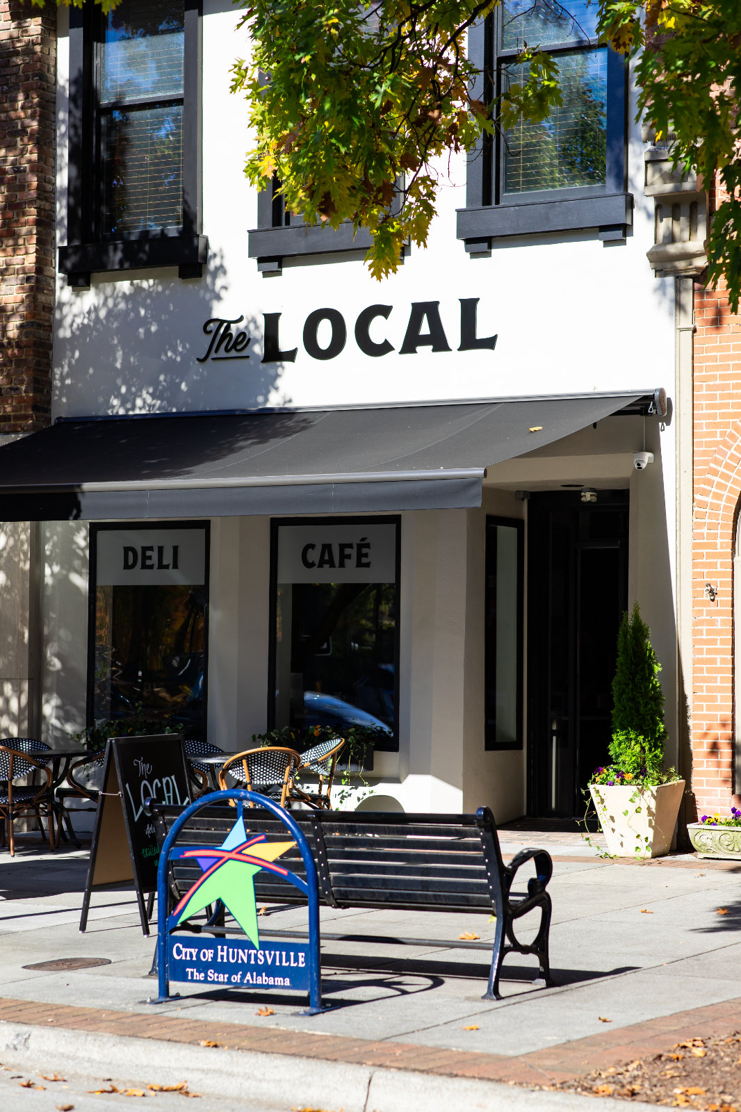 the-local-front-building-with-bench